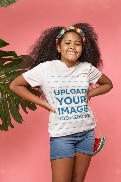 Mockup of a Girl Wearing a V-Neck Tee and a Bandana at a Studio with Palm Leaves m25628