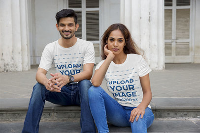 T-Shirt Mockup Featuring a Man and a Woman Sitting on the Floor