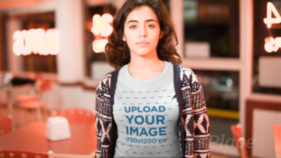 Young Woman Wearing a T-Shirt Video in a Closed Restaurant at Night