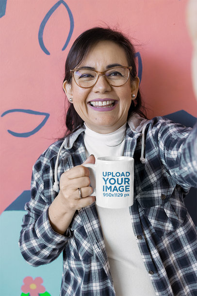 Mockup of a Happy Woman Taking a Selfie Holding an 11 oz Mug