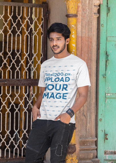 T-Shirt Mockup of a Young Man Posing on the Street
