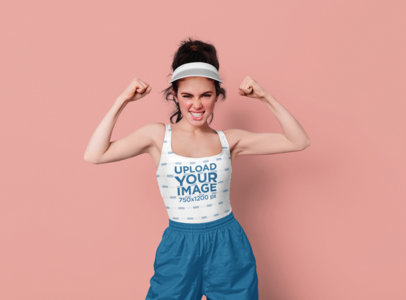 Tank Top Mockup Featuring a Young Woman Making a Strong Pose at a Studio