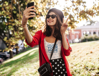 Sublimated Tank Top Mockup of a Woman Taking a Selfie at a Park