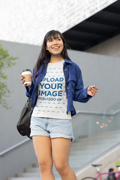 Mockup of a Woman with a T-Shirt Holding a Latte