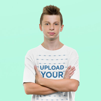 T-Shirt Mockup Featuring a Teenage Boy in a Studio