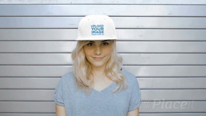 Young Lady Wearing a Snapback Hat Video Standing Against a Metal Curtain a14140