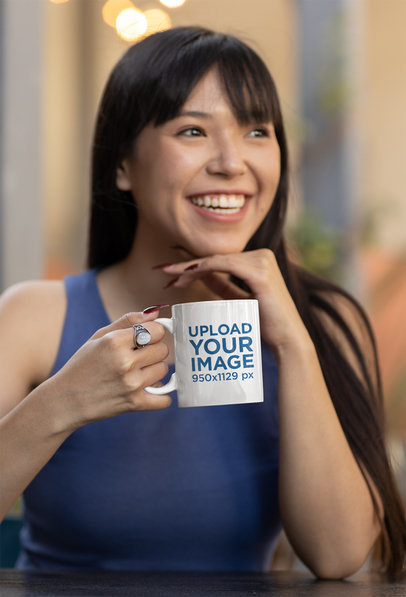 Coffee Mug Mockup of a Young Woman Hanging Out at a Café 