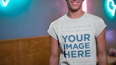 Edgy Guy Having Fun in a Dinning Room Wearing a Round Neck Tee and a Beanie Video Mockup a13506b