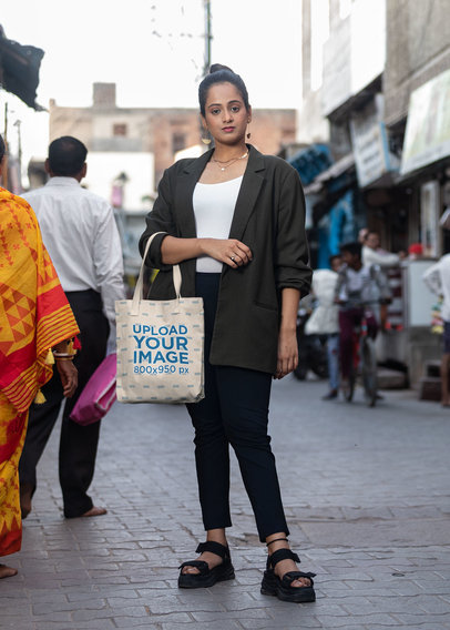 Tote Bag Mockup Featuring a Serious Woman Standing on the Street in India