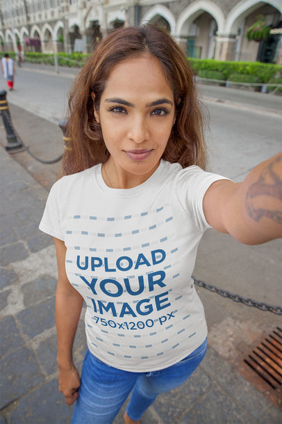 T-Shirt Mockup of a Tattooed Woman Taking a Selfie on the Street m25885