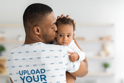 Sublimated Tee Mockup of the Back of a Dad Kissing His Baby