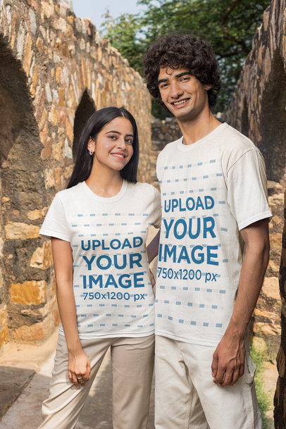 T-Shirt Mockup of a Man and a Woman Posing in an Ancient Scenario