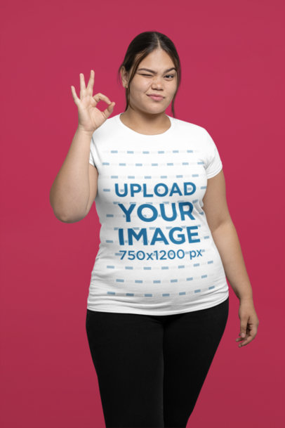 Mockup of a Cropped Face Man Pointing at His Round-Neck T-Shirt