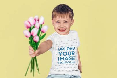 T-Shirt Mockup of a Happy Little Boy Giving Someone Flowers