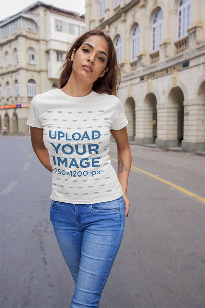 Mockup of a Serious Woman Wearing a T-Shirt Standing in the Street