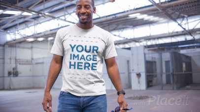 Middle Aged Man Wearing a Round Neck Tee Video Mockup in a Warehouse