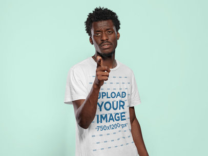 T-Shirt Mockup of a Man Pointing to the Camera with His Finger