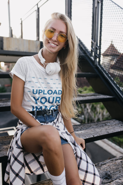 Heathered Tee Mockup of a Young Woman with Sunglasses and Headphones by a Staircase
