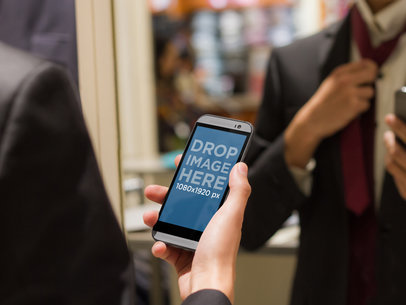HTC Mockup of Man Trying On Suit
