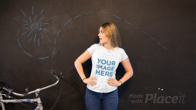 Pretty Woman Wearing a T-Shirt Stop Motion While Drawn Paper Plane Moves on Blackboard