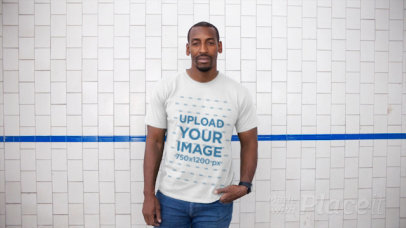 Man Wearing a Round Neck Tee Video Against a White Tiles Wall