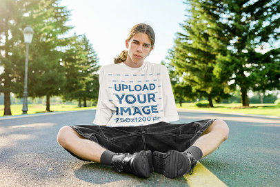 Oversized T-Shirt Featuring a Man Sitting in the Middle of the Street