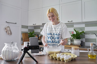 T-Shirt Mockup of a Woman Recording Herself Cooking