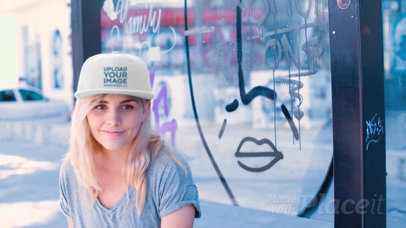 Young Skater Girl Wearing a Snapback Hat Video while Sitting on a Bus Stop a14138