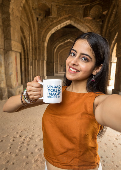 11 oz Coffee Mug Mockup of a Smiling Woman Taking a Selfie in a Temple