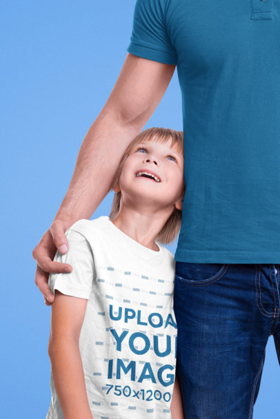 T-Shirt Mockup of a Little Boy Hugging His Dad