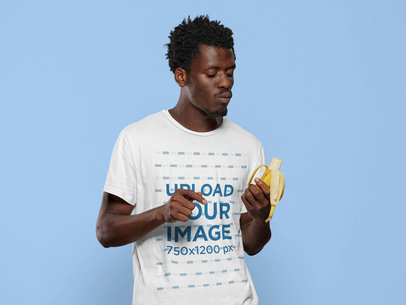 T-Shirt Mockup of a Man Looking at a Banana