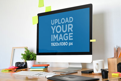 Mockup of an iMac Placed Over a Wooden Desk Featuring Sticky Notes m19078-r-el2