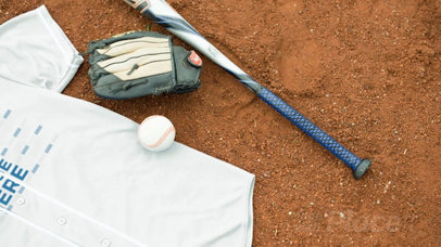 Baseball Uniform Builder - Jersey Lying on a Dirt Field
