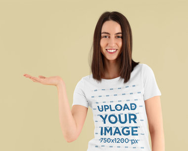 Basic T-Shirt Mockup of a Smiling Woman Showing Something With Her Hand