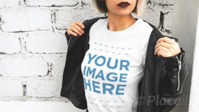 Edgy Woman Wearing a T-Shirt Stop Motion and a Leather Jacket Against a Wall
