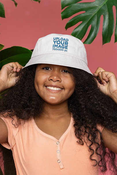Bucket Hat Mockup Featuring a Happy Girl With Curly Hair m25613