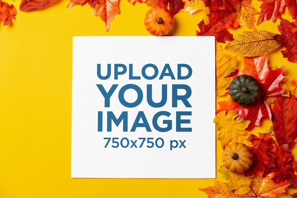Mockup of a Square Flyer Surrounded by Autumn Leaves and Small Pumpkins