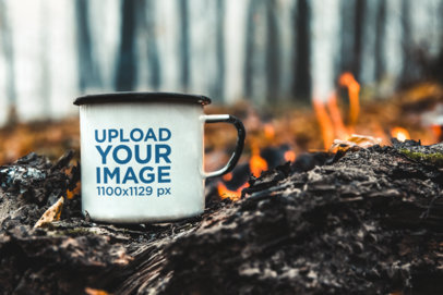 Mockup of a 12 oz Enamel Mug Placed by a Bonfire