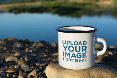 Mockup of an Enamel Coffee Mug Featuring a Lake in the Background