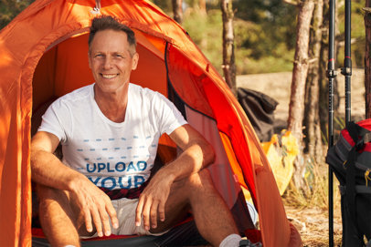 T-Shirt Mockup Featuring a Middle-Aged Man Camping