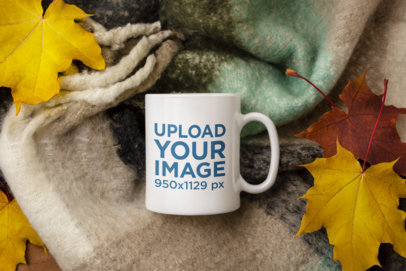 Mockup of an 11 oz Mug Placed Over a Scarf and Surrounded by Maple Leaves m25977-r-el2
