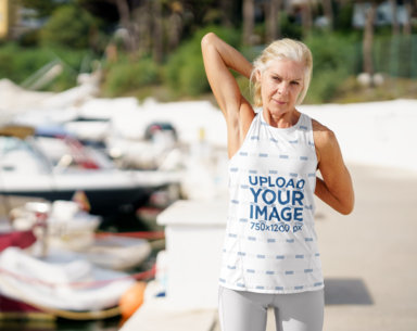 Tank Top Mockup of a Senior Woman Stretching Her Shoulders