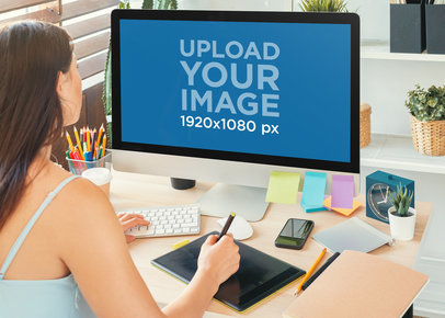 iMac Mockup Featuring a Woman Using a Drawing Tablet m18117-r-el2