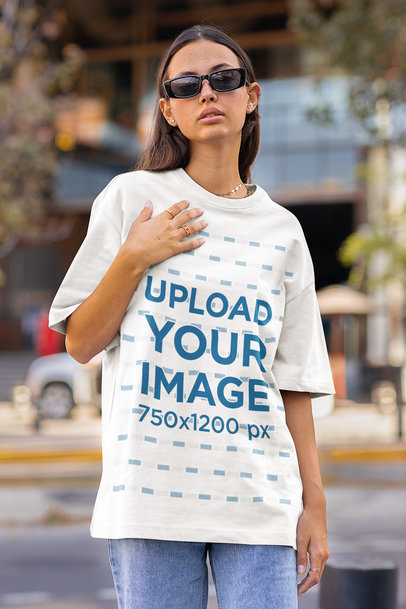 Oversized Tee Mockup of a Serious Woman Walking on the Street