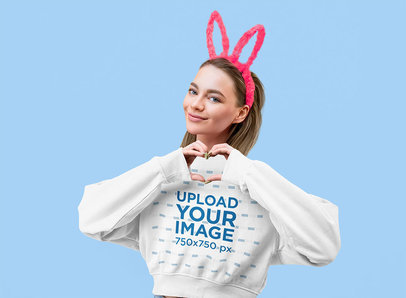 Mockup of a Woman Wearing a Sweatshirt and Bunny Ears