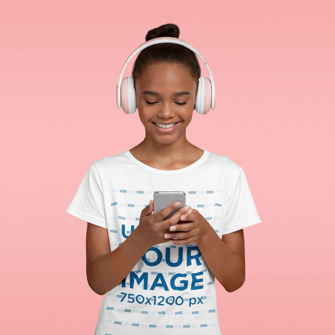 T-Shirt Mockup of a Happy Girl Listening to Some Music in a Studio