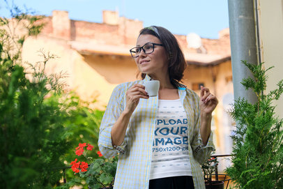Tank Top Mockup of a Woman with Glasses Holding a Small Coffee Cup