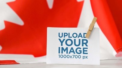 Horizontal Flyer Mockup Featuring the Flag of Canada in the Background m26052-r-el2