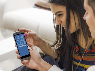 HTC One Mockup - Couple Shares a Moment Looking at Your Design