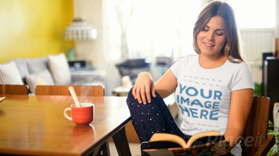 Woman Having a Coffee While Wearing a T-Shirt Cinemagraph and Reading a Book